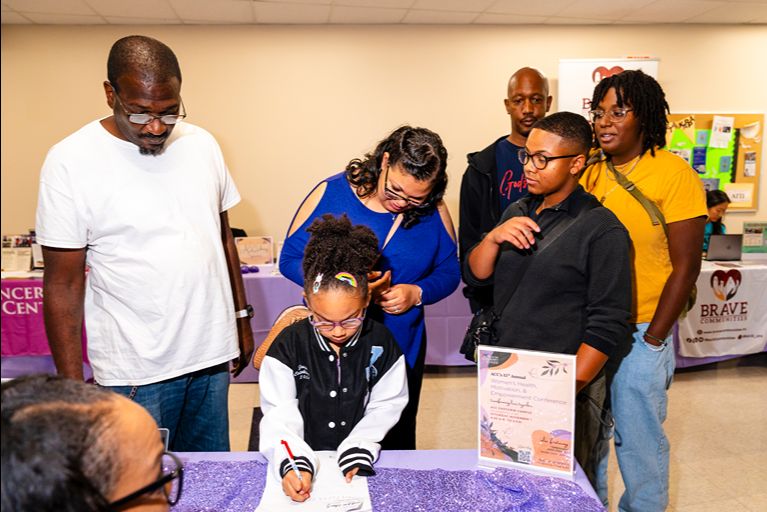 Students and parents attend the Community Conference and participate in events.